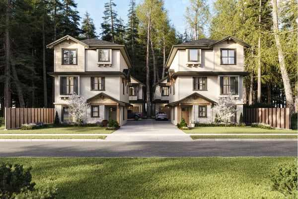 Street-level view of 7609 Coldicutt Burnaby presale development at 7609 Coldicutt Street in The Crest, featuring detached strata homes by ICON Projects & Costar Construction with shared driveway and forested surroundings.