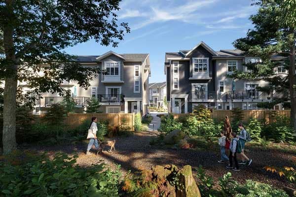 Griffon Langley townhomes in Willoughby, Langley by Sunmark at 7716 207 Street, overlooking a landscaped park walkway with mature trees, natural greenery, and residents walking along a forested path between modern townhouse buildings with balconies and contemporary exterior design