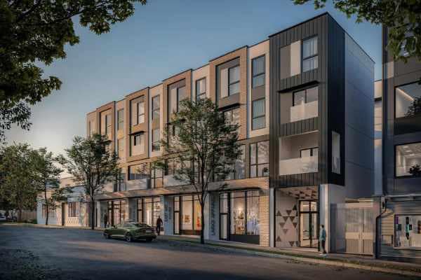 Front exterior view of Hendry, a boutique presale development by Trillium Projects in East Vancouver, featuring contemporary brick and metal architecture, private balconies, street-level retail, and a tree-lined streetscape at 3839 Commercial Street.