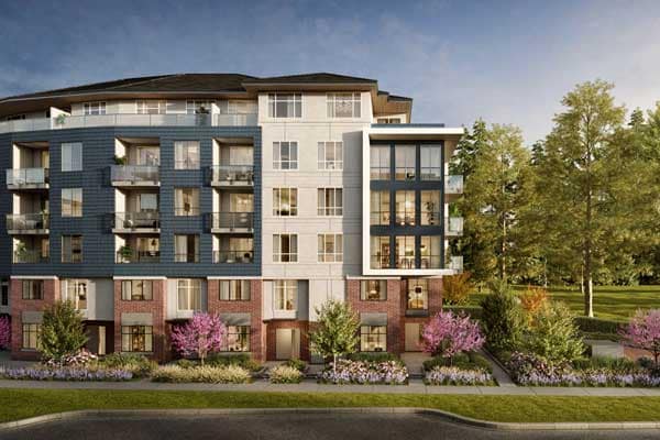Street-level exterior view of the King + Crescent Surrey condominium development by Zenterra showing a six-storey residential building with private balconies, landscaped gardens, and modern architecture in the South Surrey neighbourhood.