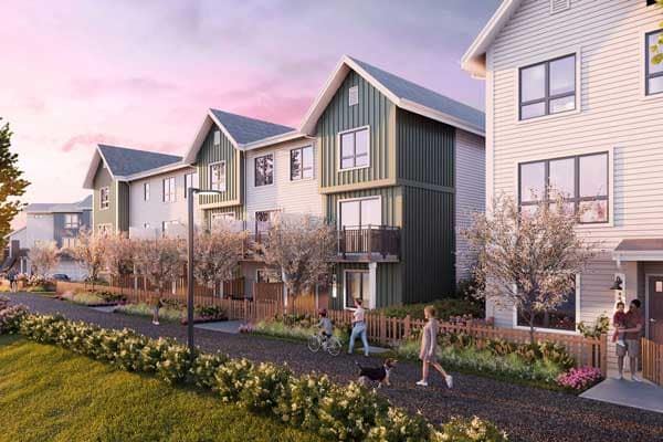 Townhome streetscape at Mercer Village New Westminster, a presale community developed by Domus Homes located at 388 Duncan Street in the Queensborough neighbourhood of New Westminster. The rendering shows contemporary three-storey townhomes with modern siding, landscaped gardens, and a pedestrian pathway where residents walk with children and pets. The image highlights the walkable residential design and family-friendly streetscape planned for Mercer Village New Westminster.