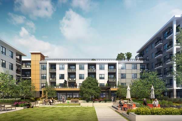 Front courtyard and building exterior rendering of Spera presale development in Surrey’s Newton neighbourhood by Northwest Development, located at 8293 King George Blvd, showcasing contemporary mid-rise residential buildings with private balconies, modern panelled façade with warm accent cladding, landscaped central green lawn, pedestrian walkways, outdoor seating areas with umbrellas, mature trees, and shared community gathering spaces designed for residents.