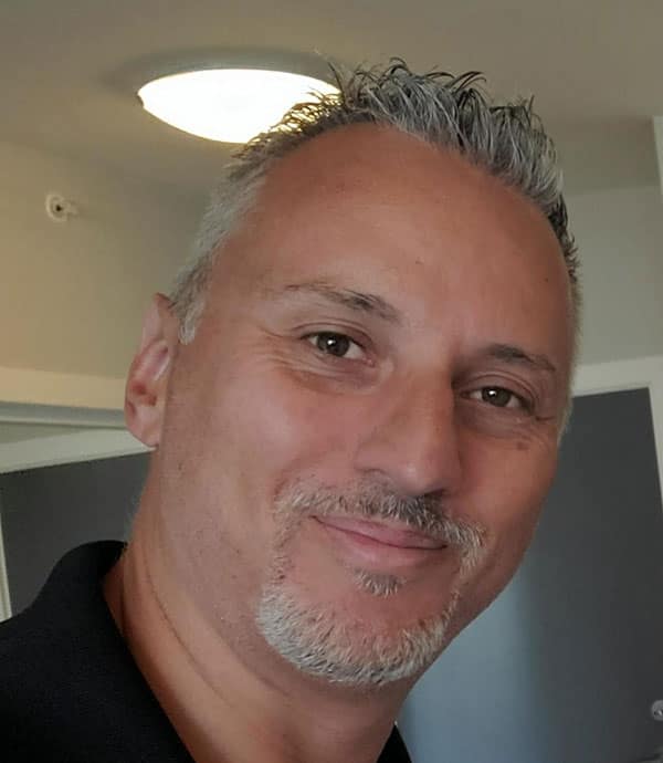 Portrait of Michael Yuri, home inspector at Best Coast Inspections, smiling confidently.