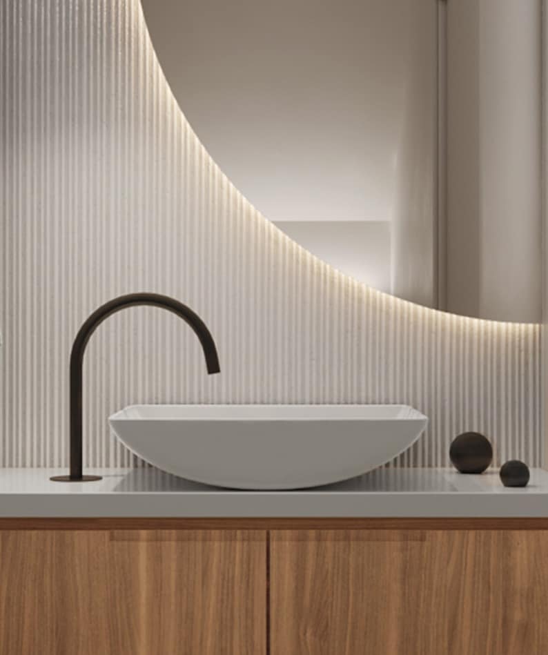 Close-up of Nolia Vancouver bathroom vanity with modern faucet and vessel sink