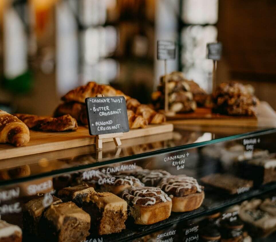 Warm interior of a local bakery and café near Rocklin Burke Mountain in Coquitlam, representing the everyday lifestyle and neighbourhood conveniences surrounding StreetSide’s presale townhome community.
